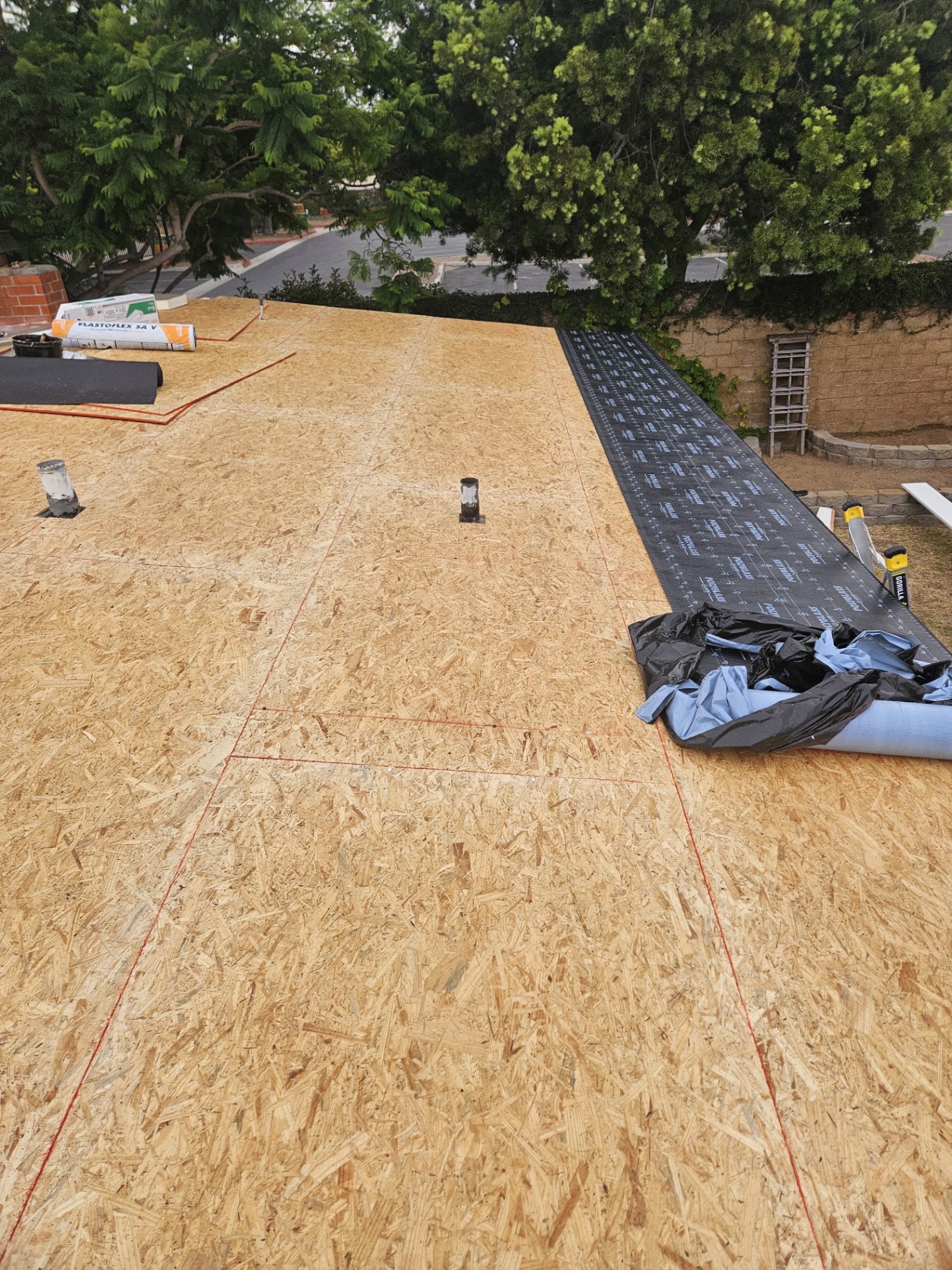 New plywood decking and Polyglass self-adhered underlayment installation