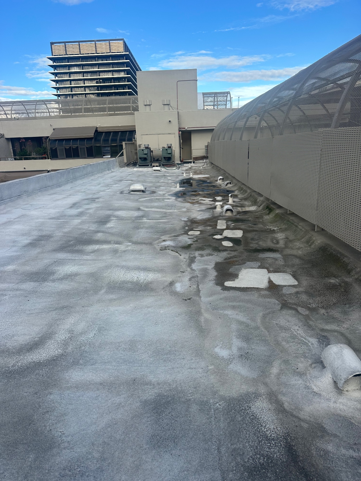Field of rooftop vents inspected on a downtown San Diego flat roof