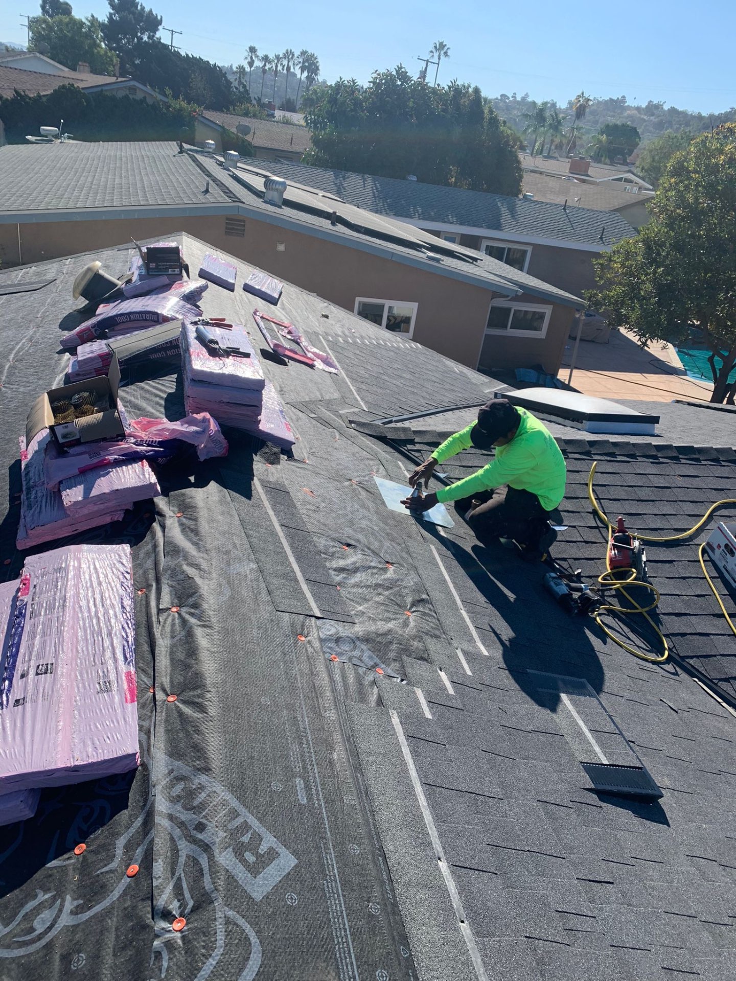 California First Roofing installer setting flashing on a San Diego shingle re-roof