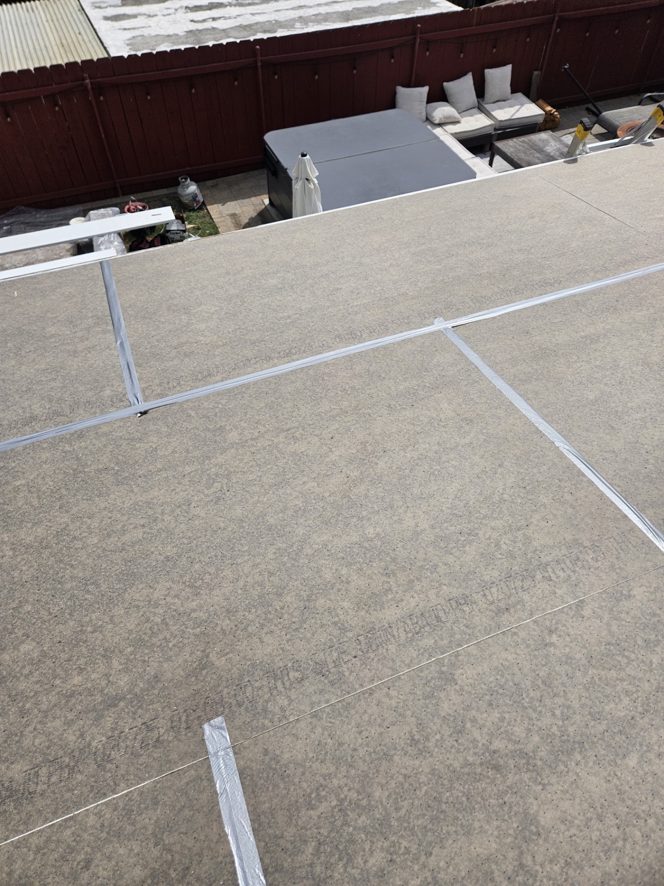 Polyiso rigid roof insulation boards fitted over a San Diego low-slope roof